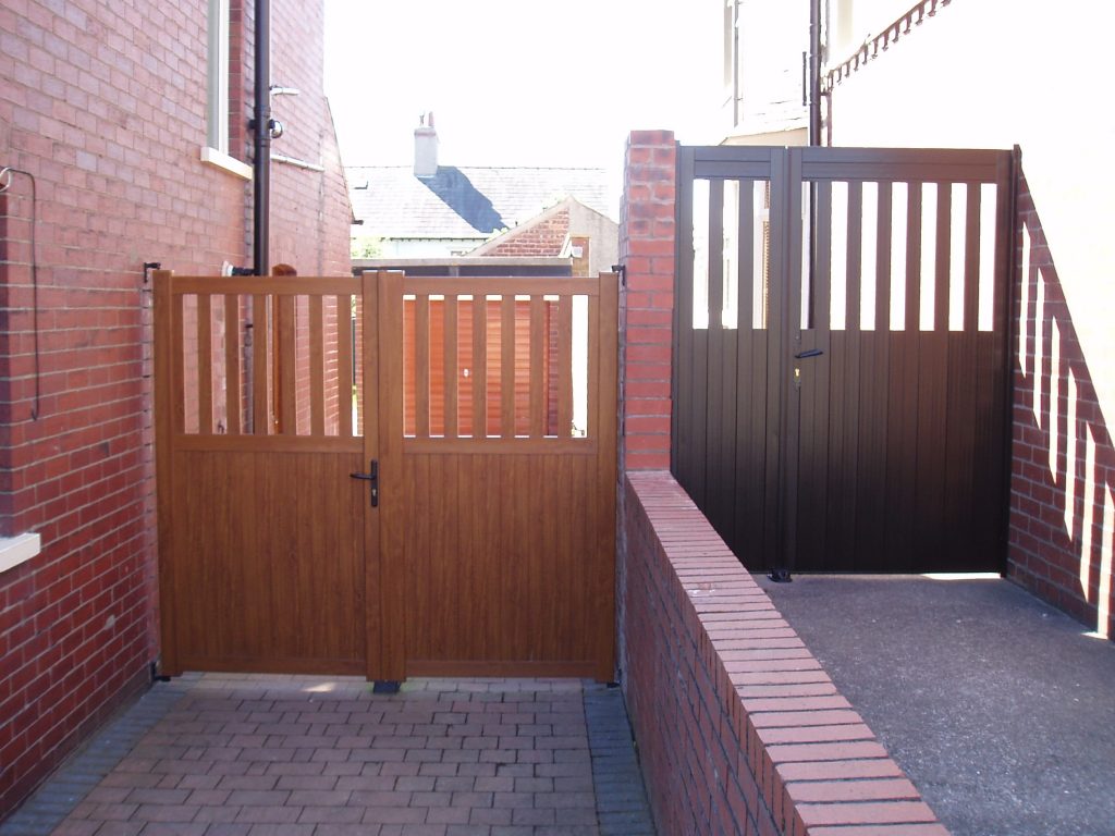 Double Executive PVCu Gate in Golden Oak Foil and a Double Bespoke PVCu Gate in Black Brown Foil Coventry
